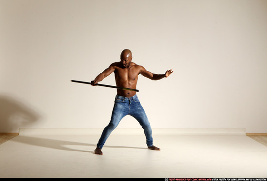 Man Adult Athletic Black Fighting with spear Moving poses Pants