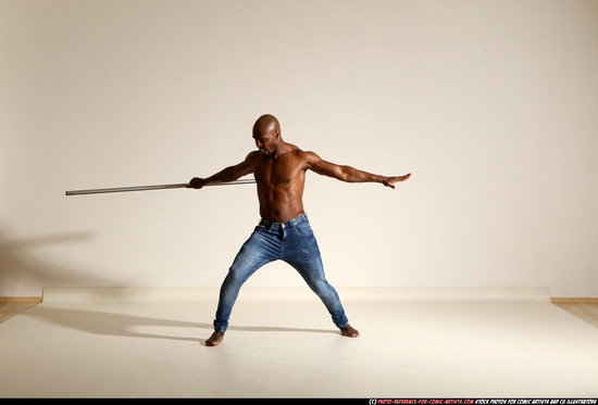 Man Adult Athletic Black Fighting with spear Moving poses Pants