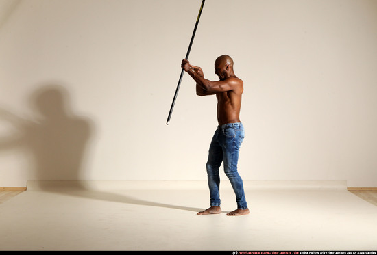 Man Adult Athletic Black Fighting with spear Moving poses Pants