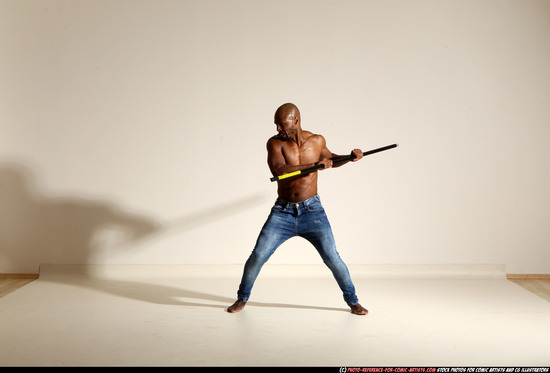 Man Adult Athletic Black Fighting with spear Moving poses Pants