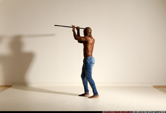 Man Adult Athletic Black Fighting with spear Moving poses Pants