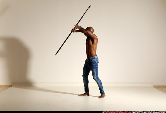 Man Adult Athletic Black Fighting with spear Moving poses Pants