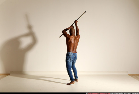 Man Adult Athletic Black Fighting with spear Moving poses Pants