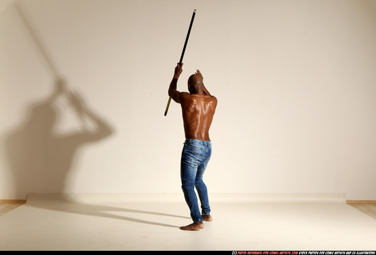 Man Adult Athletic Black Fighting with spear Moving poses Pants