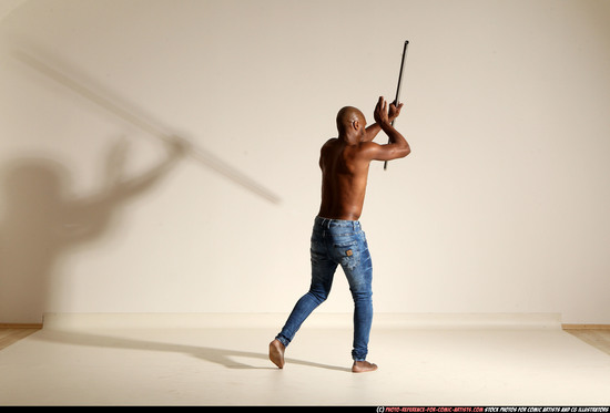 Man Adult Athletic Black Fighting with spear Moving poses Pants