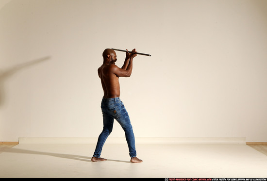 Man Adult Athletic Black Fighting with spear Moving poses Pants