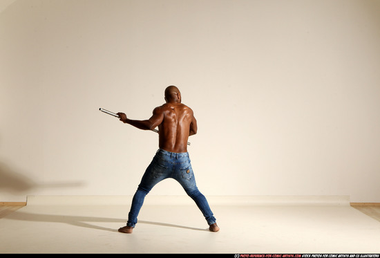 Man Adult Athletic Black Fighting with spear Moving poses Pants