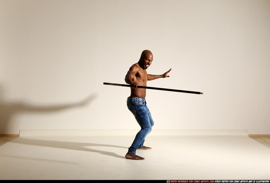 Man Adult Athletic Black Fighting with spear Moving poses Pants