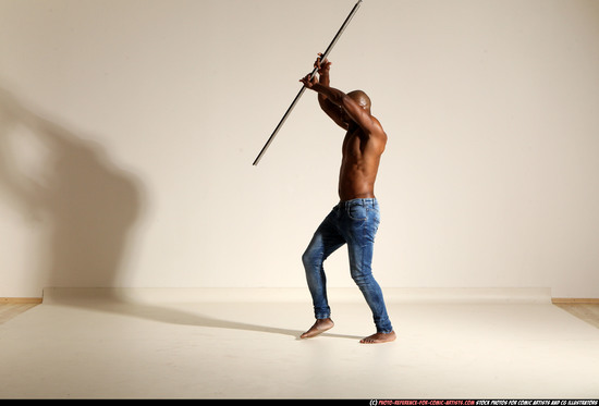 Man Adult Athletic Black Fighting with spear Moving poses Pants