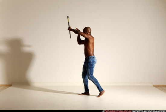 Man Adult Athletic Black Fighting with spear Moving poses Pants