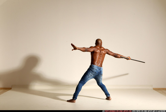 Man Adult Athletic Black Fighting with spear Moving poses Pants