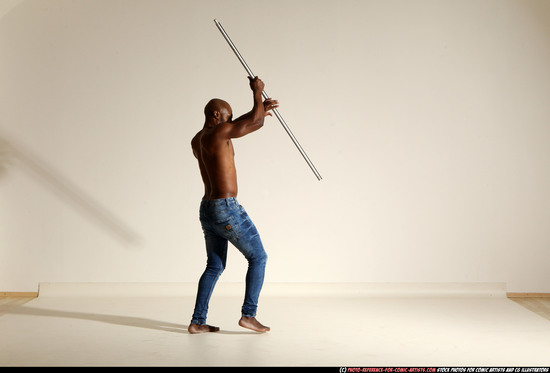 Man Adult Athletic Black Fighting with spear Moving poses Pants