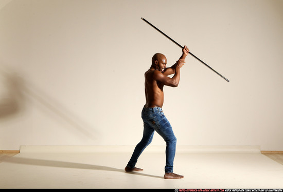 Man Adult Athletic Black Fighting with spear Moving poses Pants