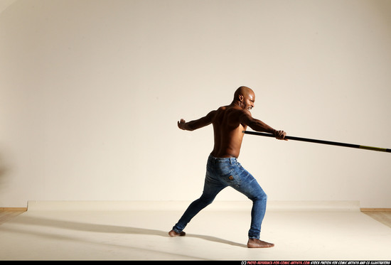 Man Adult Athletic Black Fighting with spear Moving poses Pants