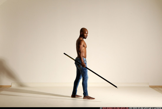 Man Adult Athletic Black Fighting with spear Moving poses Pants