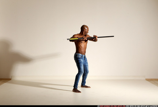 Man Adult Athletic Black Fighting with spear Moving poses Pants