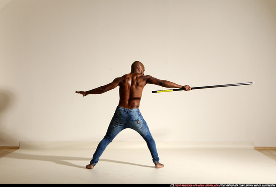 Man Adult Athletic Black Fighting with spear Moving poses Pants