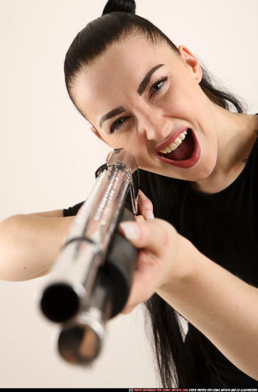 Woman Adult Athletic White Fighting with gun Standing poses Casual