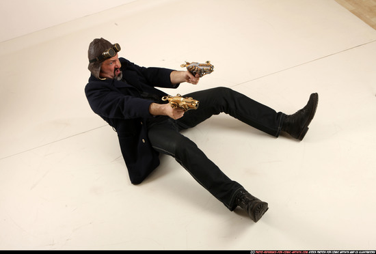 Man Old Average White Fighting with gun Sitting poses Casual