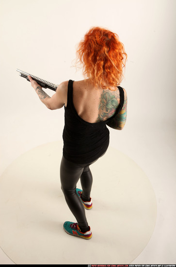 Woman Adult Athletic White Standing poses Casual Fighting with shotgun