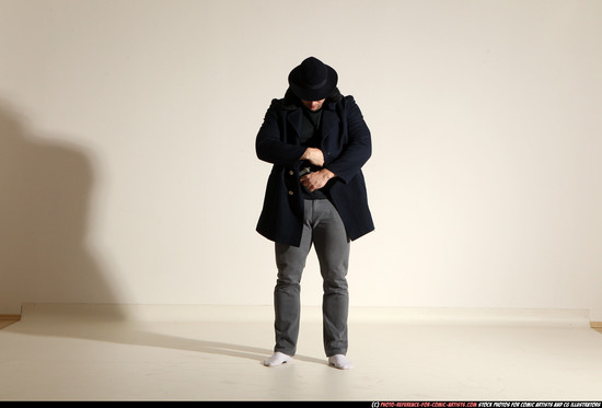 Man Adult Muscular White Fighting with gun Standing poses Coat