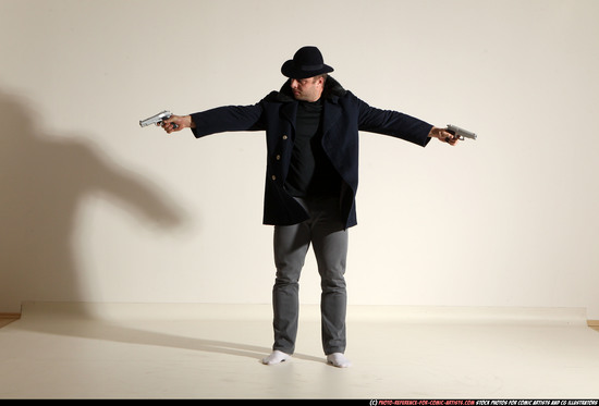 Man Adult Muscular White Fighting with gun Standing poses Coat