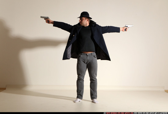 Man Adult Muscular White Fighting with gun Standing poses Coat