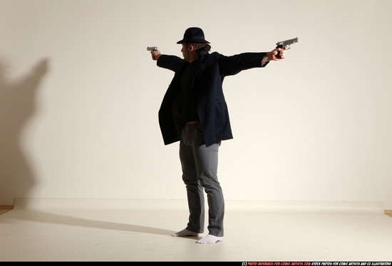 Man Adult Muscular White Fighting with gun Standing poses Coat