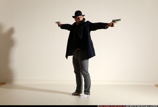 Man Adult Muscular White Fighting with gun Standing poses Coat