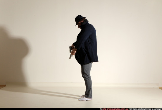 Man Adult Muscular White Fighting with gun Standing poses Coat