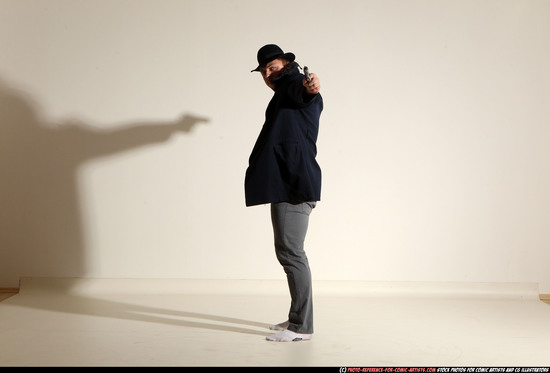 Man Adult Muscular White Fighting with gun Standing poses Coat