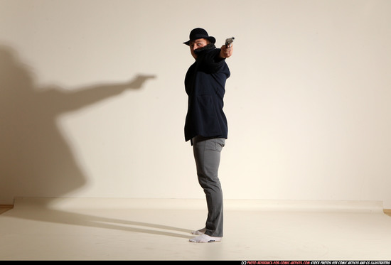 Man Adult Muscular White Fighting with gun Standing poses Coat