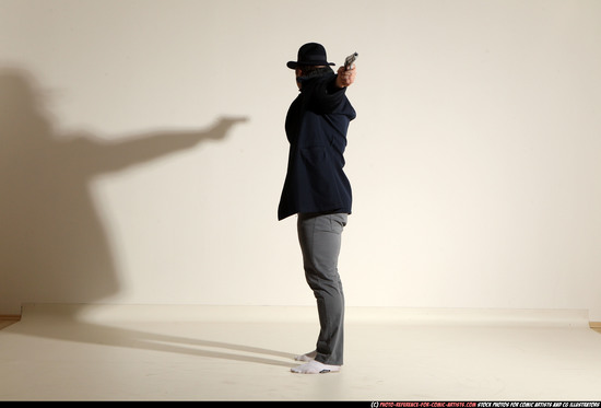 Man Adult Muscular White Fighting with gun Standing poses Coat