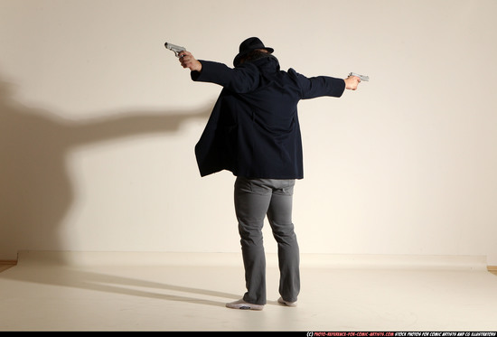 Man Adult Muscular White Fighting with gun Standing poses Coat