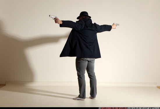 Man Adult Muscular White Fighting with gun Standing poses Coat