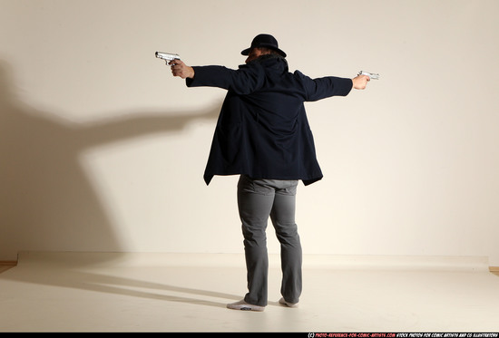 Man Adult Muscular White Fighting with gun Standing poses Coat