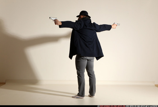 Man Adult Muscular White Fighting with gun Standing poses Coat