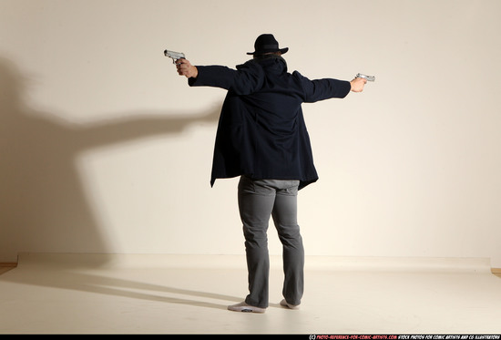 Man Adult Muscular White Fighting with gun Standing poses Coat