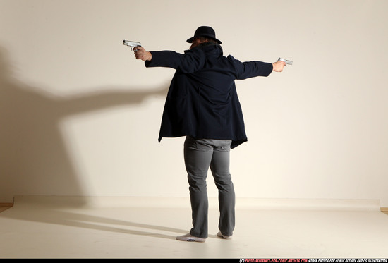 Man Adult Muscular White Fighting with gun Standing poses Coat