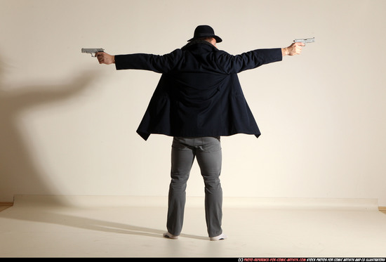 Man Adult Muscular White Fighting with gun Standing poses Coat