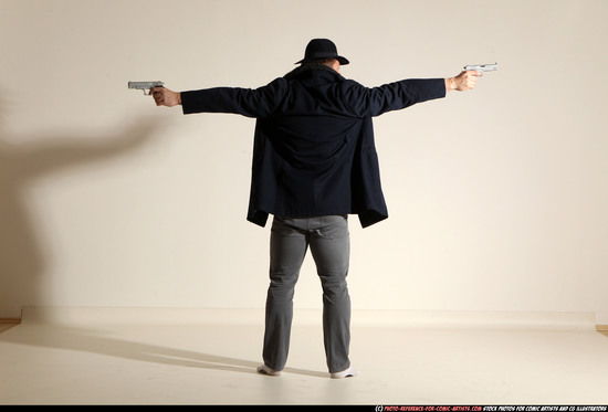 Man Adult Muscular White Fighting with gun Standing poses Coat