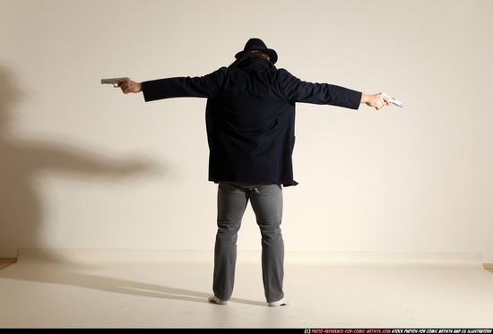 Man Adult Muscular White Fighting with gun Standing poses Coat