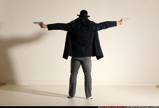 Man Adult Muscular White Fighting with gun Standing poses Coat