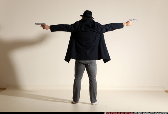 Man Adult Muscular White Fighting with gun Standing poses Coat