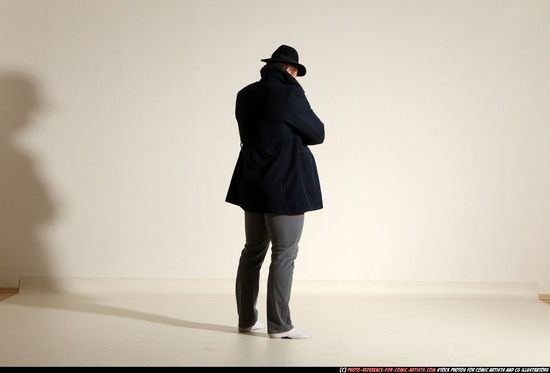 Man Adult Muscular White Fighting with gun Standing poses Coat