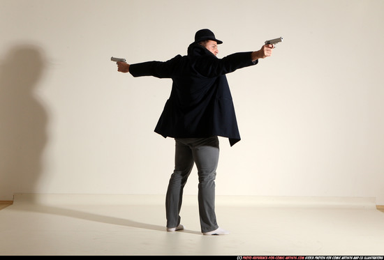 Man Adult Muscular White Fighting with gun Standing poses Coat