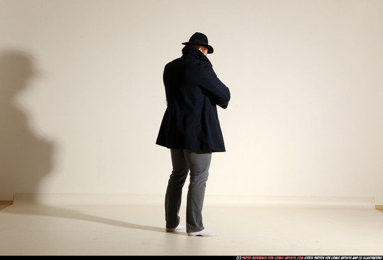 Man Adult Muscular White Fighting with gun Standing poses Coat