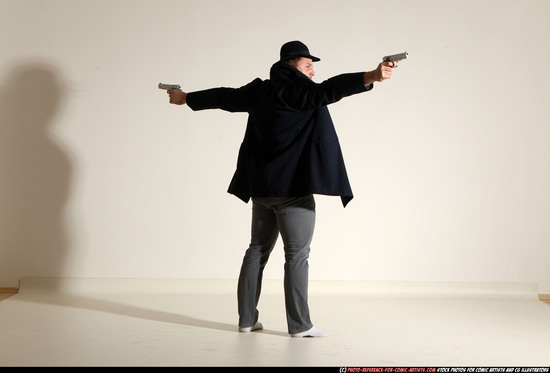 Man Adult Muscular White Fighting with gun Standing poses Coat