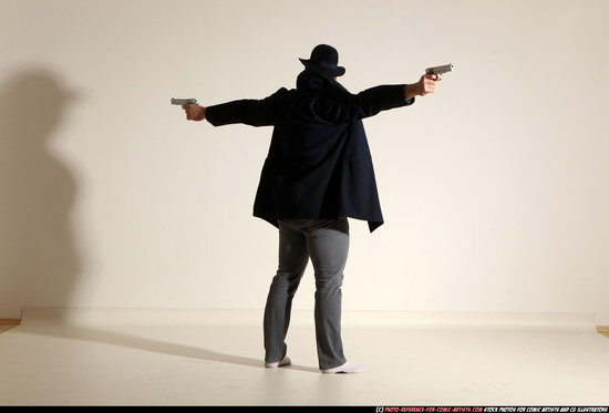 Man Adult Muscular White Fighting with gun Standing poses Coat