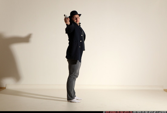 Man Adult Muscular White Fighting with gun Standing poses Coat